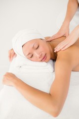 Fototapeta na wymiar Attractive woman receiving back massage