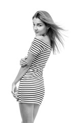 Fototapeta premium Girl in a striped dress on a white background.
