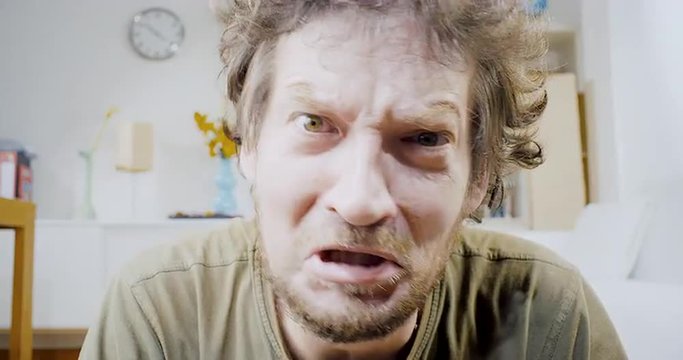 Man shouting no looking camera at home