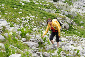 Woman hiking into the mountains