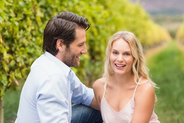 Young happy couple smiling at camera