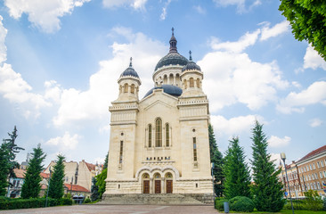 Fototapeta na wymiar Orthodox Cathedral in Cluj-Napoca city Transylvania region of Romania in the Avram Iancu Square on a beautiful summer day with a blue sky