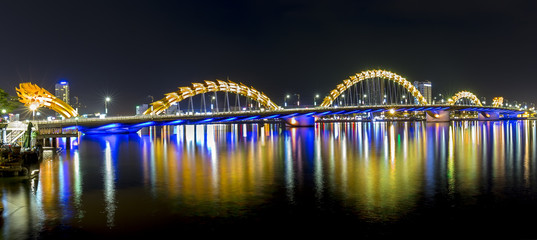 Dragon Bridge, Da Nang nightlife with lights shining down bridges along the Han River shimmering. This is the pride of Da Nang, the city's tourism