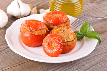 Stuffed tomatoes on a white plate. 
