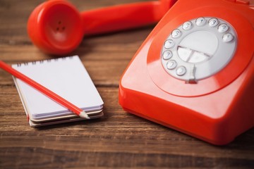Telephone on table with notepad