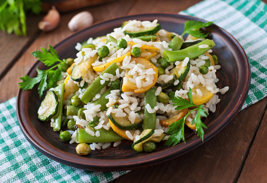 Risotto with asparagus beans, zucchini and green peas
