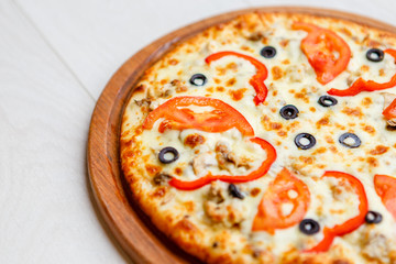 pizza on wooden plate