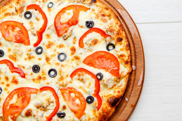 pizza on wooden plate