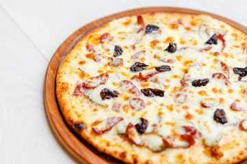 pizza on wooden plate