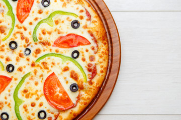pizza on wooden plate