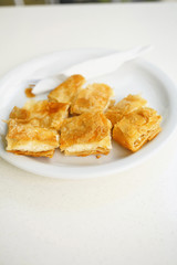 Cheese pie/Cheese pie.Home made cheese pie pieces on plate. Very shallow depth of field for soft background. Traditional food