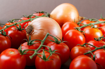 Still-life with onions and cherry tomatoes