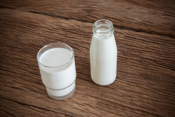 fresh milk in glass bottle and glass