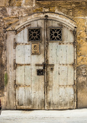 wooden garage doors in a street in Valletta