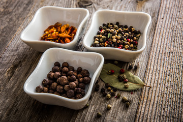 different kinds of pepper in bowls