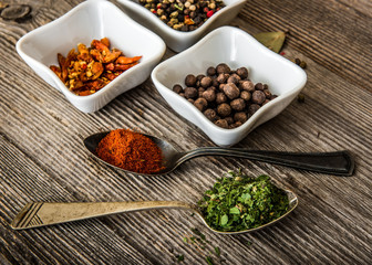 spices in bowls and spoons