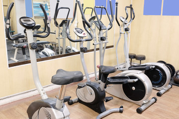 Interior of a fitness hall with the fitness bycicle