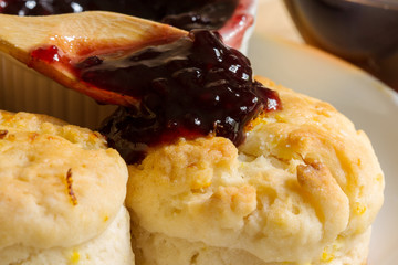 Home made orange english biscuit with blackberry jam.