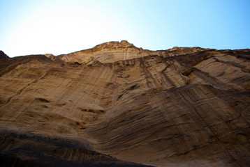 The long, hot road in the ancient city of Petra. Jordan. The road runs between the rocks and through narrow gorges. Ancient caves like home. The remains of an ancient aqueduct. Spring 2010.
