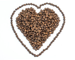 Coffee beans in heart shape with line around heart on white back