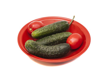 tomatoes and green cucumbers 