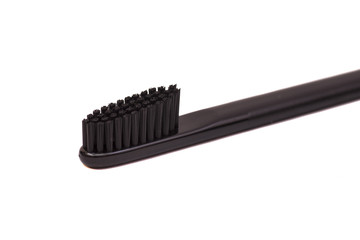 Black toothbrush isolated on white background