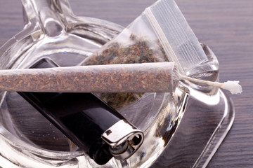 Close up of marijuana and smoking paraphernalia - obrazy, fototapety, plakaty