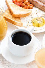 traditional breakfast - coffee, juice, eggs, toast, vertical