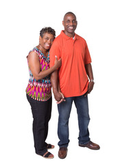 Full length portrait of an older couple standing close
