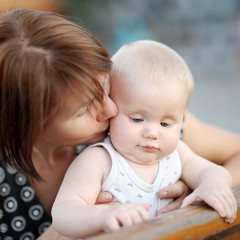 Beautiful middle aged woman and her adorable little grandson