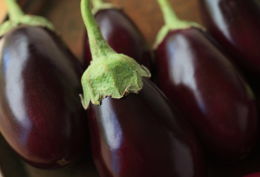 A grouping of fresh eggplants close up