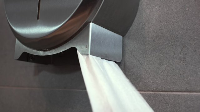 Pulling toilet paper.