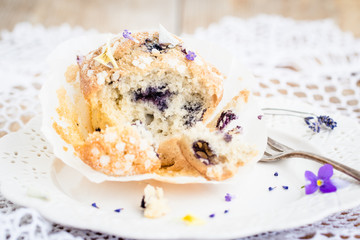 Homemade muffin with blueberry and lavender. Selective focus.