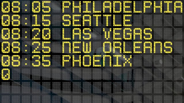 Close-Up of an airport departure board with USA cities destinations.  4k video resolution (4096x2304).
