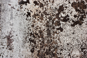 Textured walls with dirt.