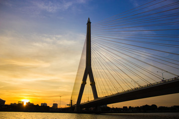 Fototapeta na wymiar The Rama VIII Bridge is a cable-stayed bridge crossing the Chao