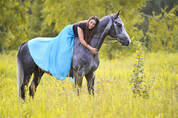 Woman and grey horse