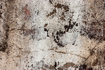 Textured walls with dirt.