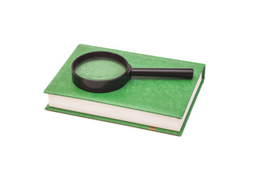 Magnifying glass and book isolated on white 