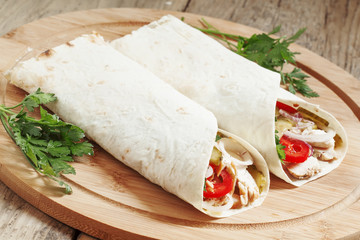 Shawarma, turkish doner kebab, roll with meat and pita bread on