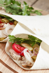 Shawarma, turkish doner kebab, roll with meat and pita bread on