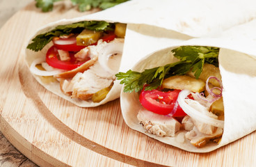 Shawarma, turkish doner kebab, roll with meat and pita bread on