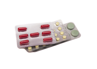 Colorful of oral medications on white 