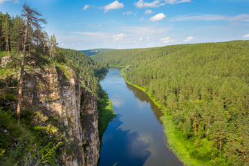 Fototapeta na wymiar Tourist route to the Urals. Hay River, Big prites view from the top and bright blue sky
