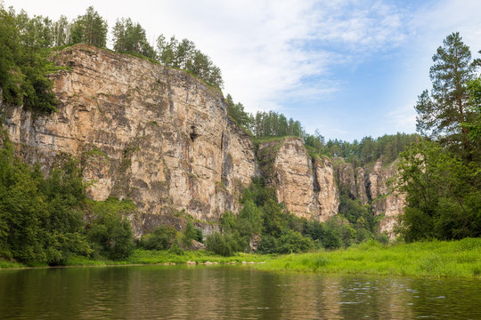 Tourist route to the Urals. Entrance to the cave at an altitude of 60 meters in rock