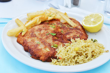 Fried pork chops with fries