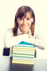 Smiling woman with textbooks