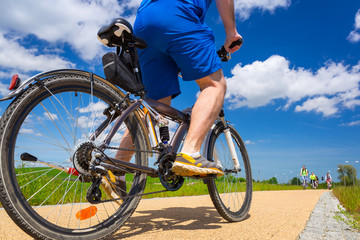 Cyclist on the bicycle road at sunny day, Poland