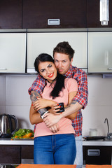 Young couple hugging in the kitchen