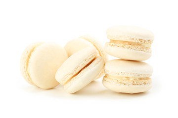 Tasty beige macarons isolated on white
